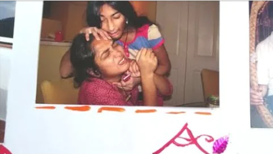 Clickable video thumbnail of a photo of a woman and her daughter play-fighting.