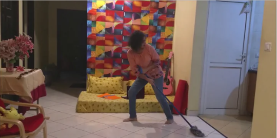Clickable video thumbnail of a woman dancing with a mop.