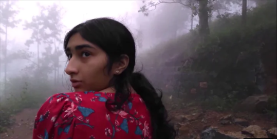 Clickable video thumbnail of a scared girl in the woods.
