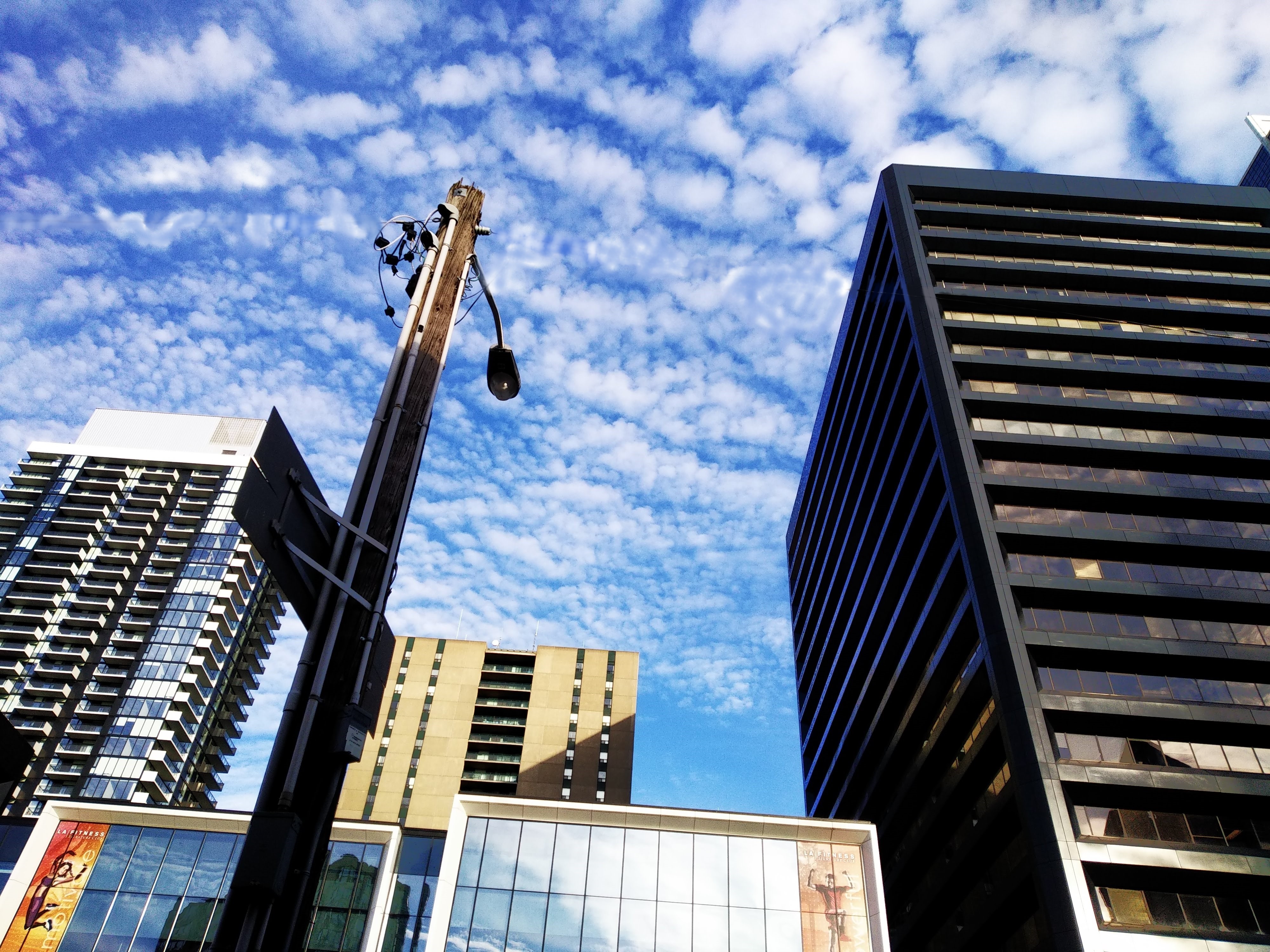 Clickable video thumbnail of a downtown city sky.